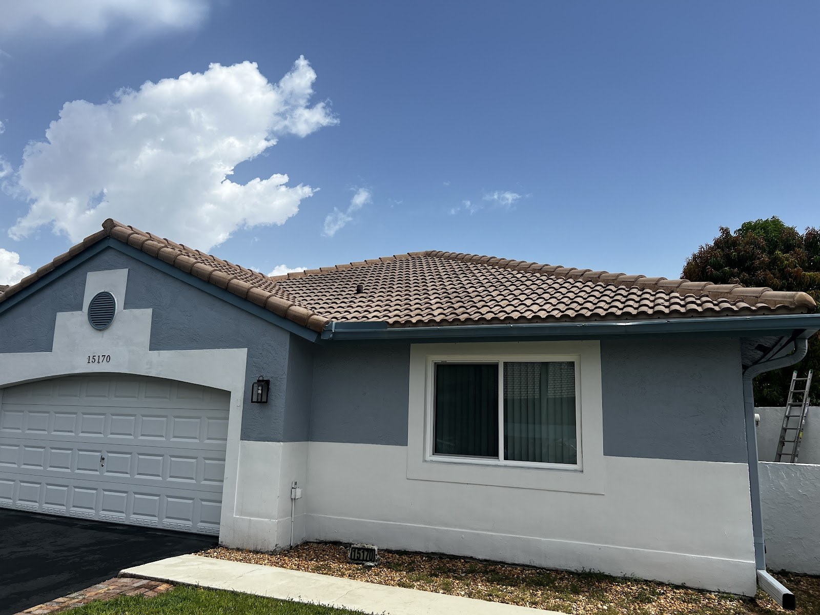 Two-story home exterior, freshly washed